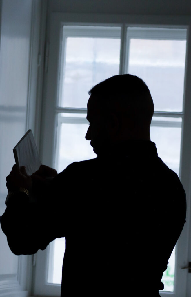 A picture containing window, indoor, person, looking
Description automatically generated